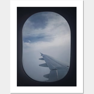 Plane flight through the dense clouds Posters and Art